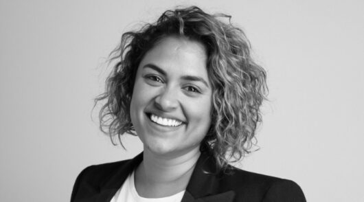 A black and white headshot of Charlene Perera