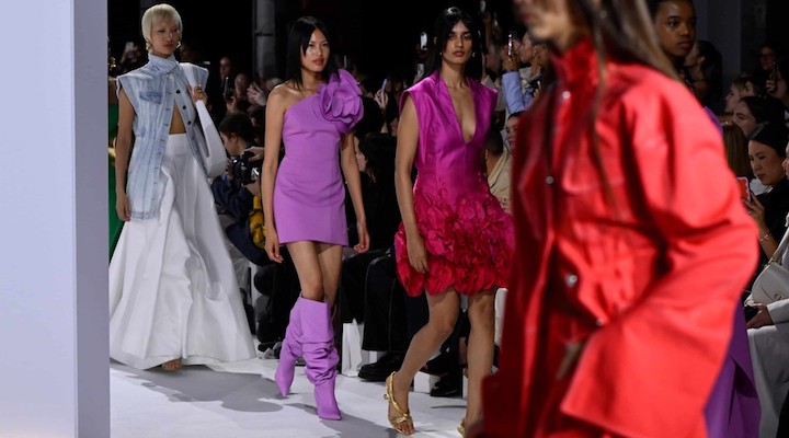 Models walk the Acler runway show at Carriageworks in a long red dress for Australian Fashion Week 2024