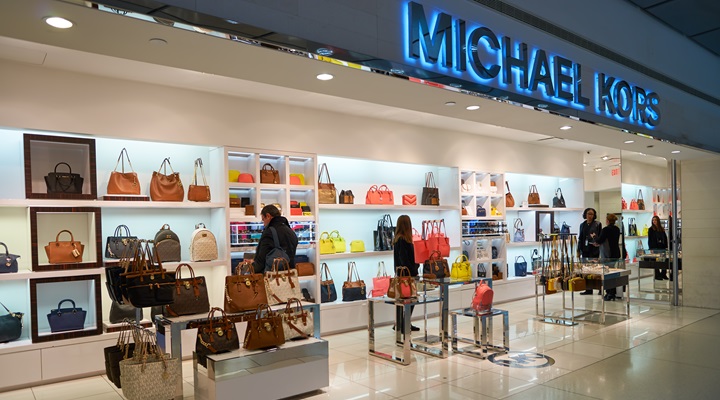 An image of the exterior of a Michael Kors store at JFK airport