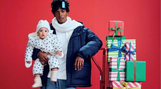 A man and baby wear Old Navy clothes in Black Friday campaign image.