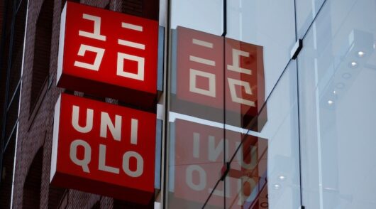 Fast Retailing's Uniqlo sign boards are displayed at a casual clothing store