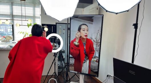 Influencer Tera Feng prepares before hosting a livestream sales session on the social media platform Xiaohongshu, at her apartment in Shanghai, China December 16, 2024.