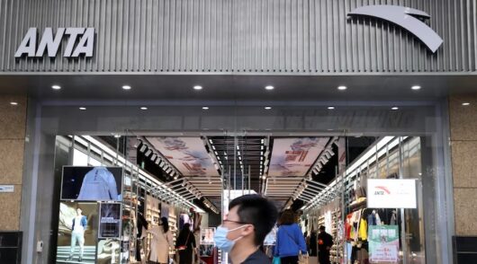 A man walks past a store of Chinese sportswear firm Anta Sports at a shopping mall in Beijing, China March 25, 2021.