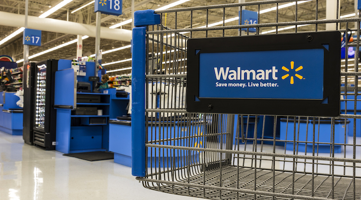 A close-up view of a Walmart shopping cart in an empty store