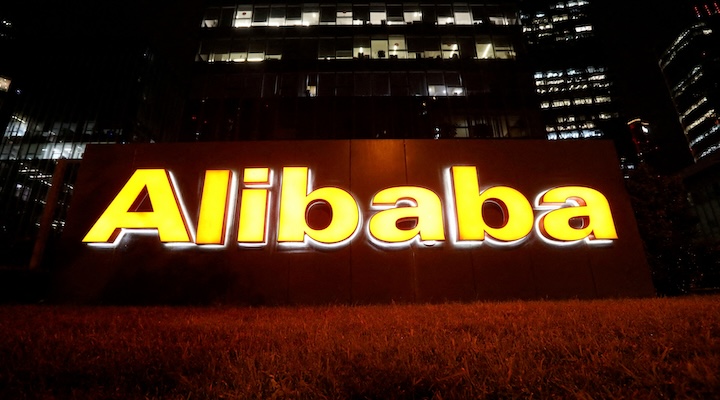 The logo of Alibaba Group is lit up at its office building in Beijing, China August 9, 2021.