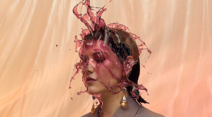 Four Pillars Shiraz gin being poured over a model