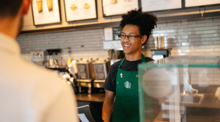 Starbucks barista greeting a customer