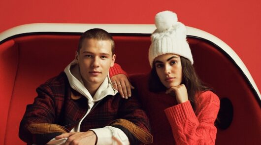 a man and woman in American Eagle winter outfits