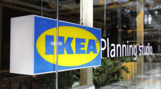 An Ikea 'Planning Studio' sign in the front window of a store