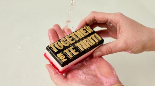 product shot of bar of soap and hands for lush together for te tiriti campaign 2024