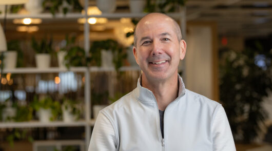 Ikea's chief operating officer Rob Olson standing against an Ikea store display.