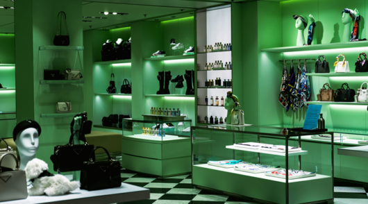 A luxury store interior with green walls and black and white floors