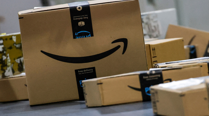 several brown cardboard boxes with amazon branded tape and logo