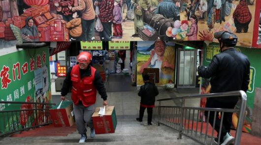 JD.com delivery worker picks up grocery orders