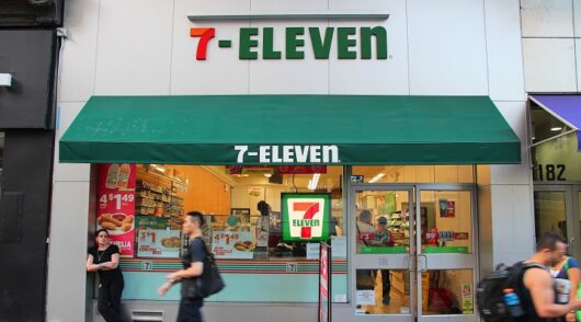 People walk in front of 7-Eleven store in New York
