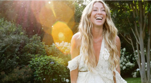 loveshackfancy founder rebecca hessel cohen wearing a white off the shoulder dress