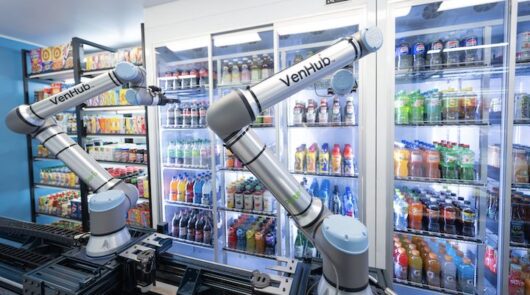 An exterior shot of a Venhub store, with cranes reaching for a stock-keeping unit.