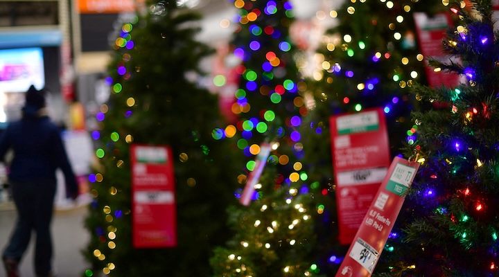 Image of artificial Christmas trees for sale at Home Depot store.