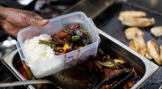 Food is put into a plastic box