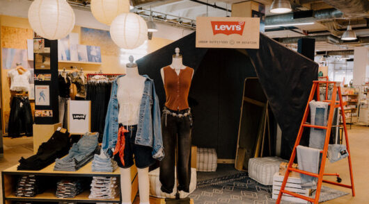 An interior shot of an Urban Outfitters store featuring the On Rotation brand pop-up with Levi’s.