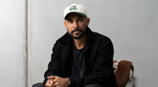 head shot of rollie nation founder vince lebon wearing a white cap and black jacket