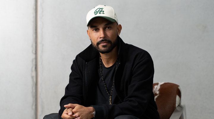 head shot of rollie nation founder vince lebon wearing a white cap and black jacket