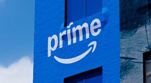 A downtown building wrapped in Amazon Prime advertising