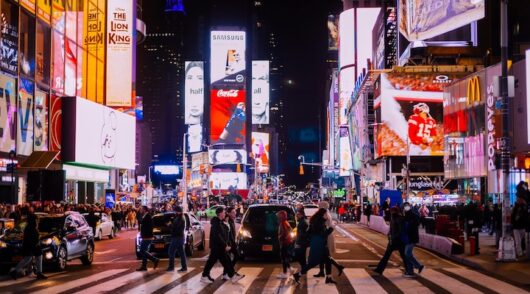 People crossing street near Time Square in New York