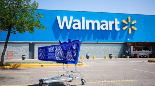 a shopping cart in front of Walmart store