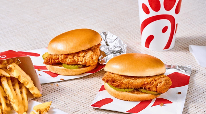 a photo of chicken sandwiches and a branded cup from chick-fil-a