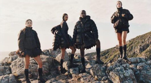 Image of models on a mountain.
