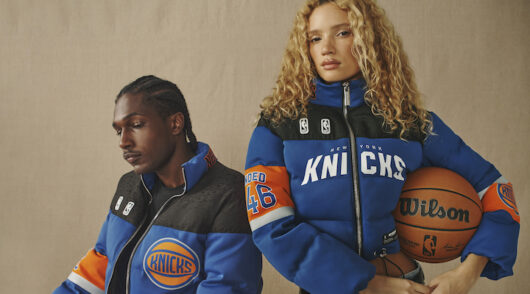 A male and female model wearing Knicks-themed Off Season merchandise.