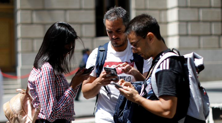 People looking at their phones in Manhattan