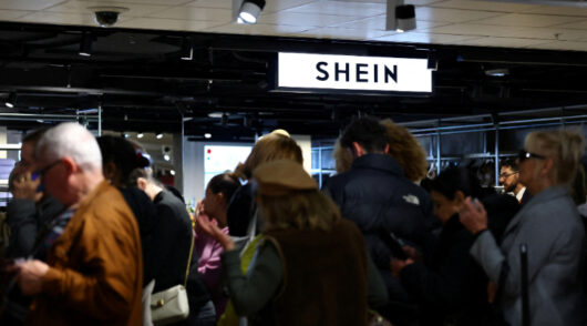 Customers queue to enter Shein’s new store inside Le BHV Marais.