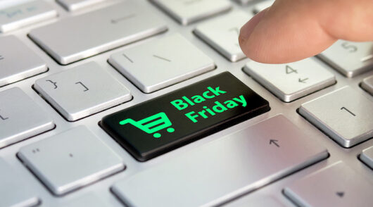 A white keyboard with a singular black key stamped with “Black Friday”.