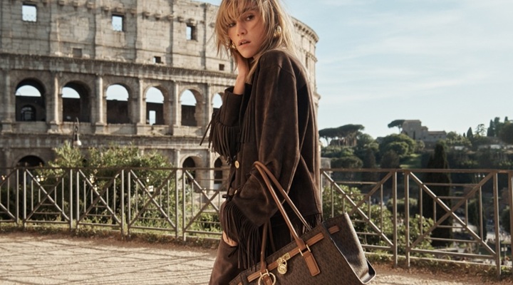 a model with Michael Kors luxury bag