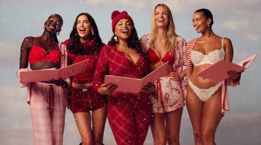 A line-up of Victoria’s Secret models dressed up in holiday-themed attire.