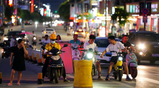 A Meituan delivery rider at a junction in Guangxi Zhuang, China.