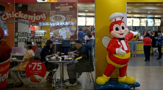 Customers dine in a branch of Jollibee in Manila, Philippines