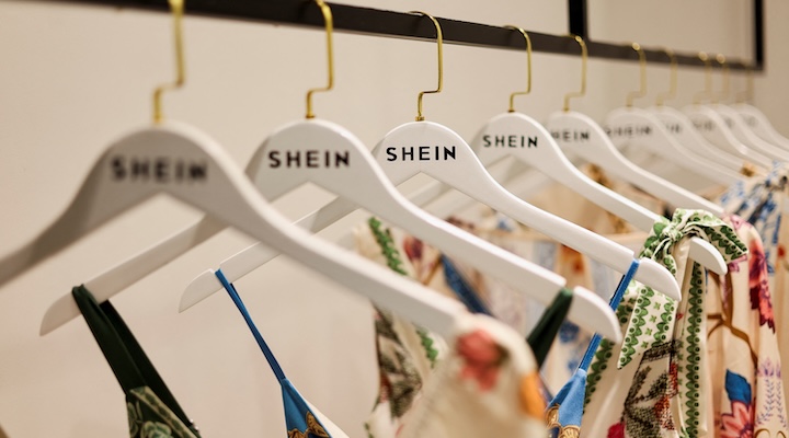 Clothes from fast-fashion brand Shein hang at their office