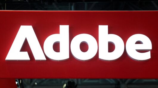 Signage for Adobe is displayed at National Retail Federation (NRF) 2026