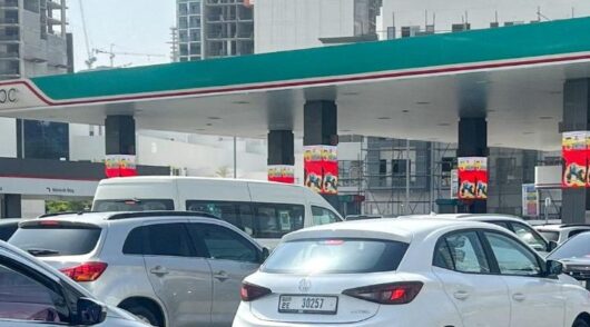 Cars queue at Dubai fuel station.