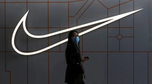 Nike logo with passerby.