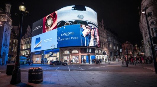 Piccadilly Circus digital billboard at night.