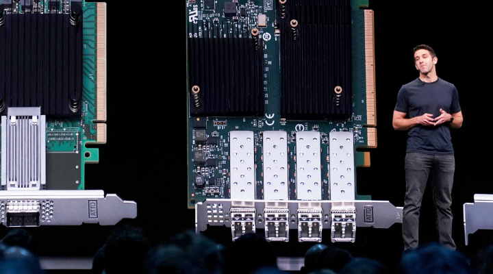 Apple exec presents hardware on stage.