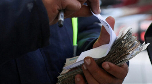 Counting cash and receipts.