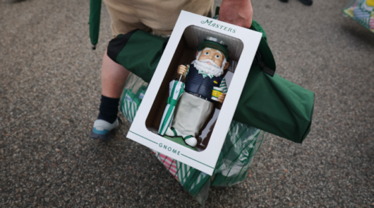 Masters gnome in shopper’s hand.