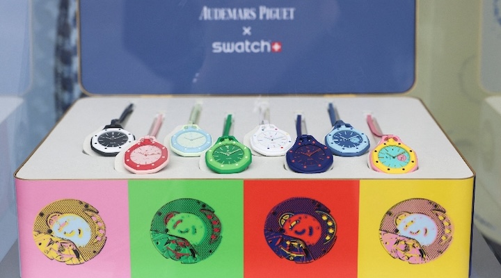 A box of Audemars Piguet and Swatch 'Royal Pop' watches is displayed.