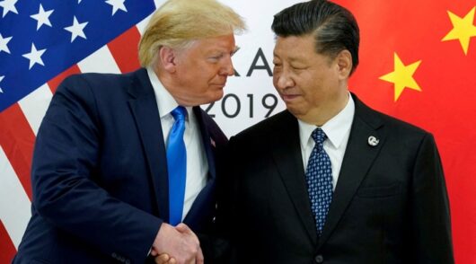Trump and Xi shake hands.