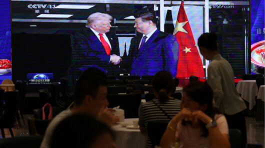 Trump and Xi handshake on TV.